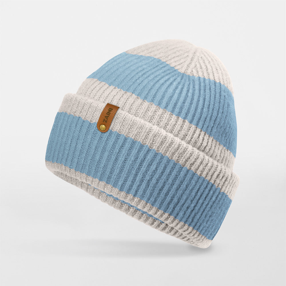 Knitted beanie with blue and beige stripes on a light gray background