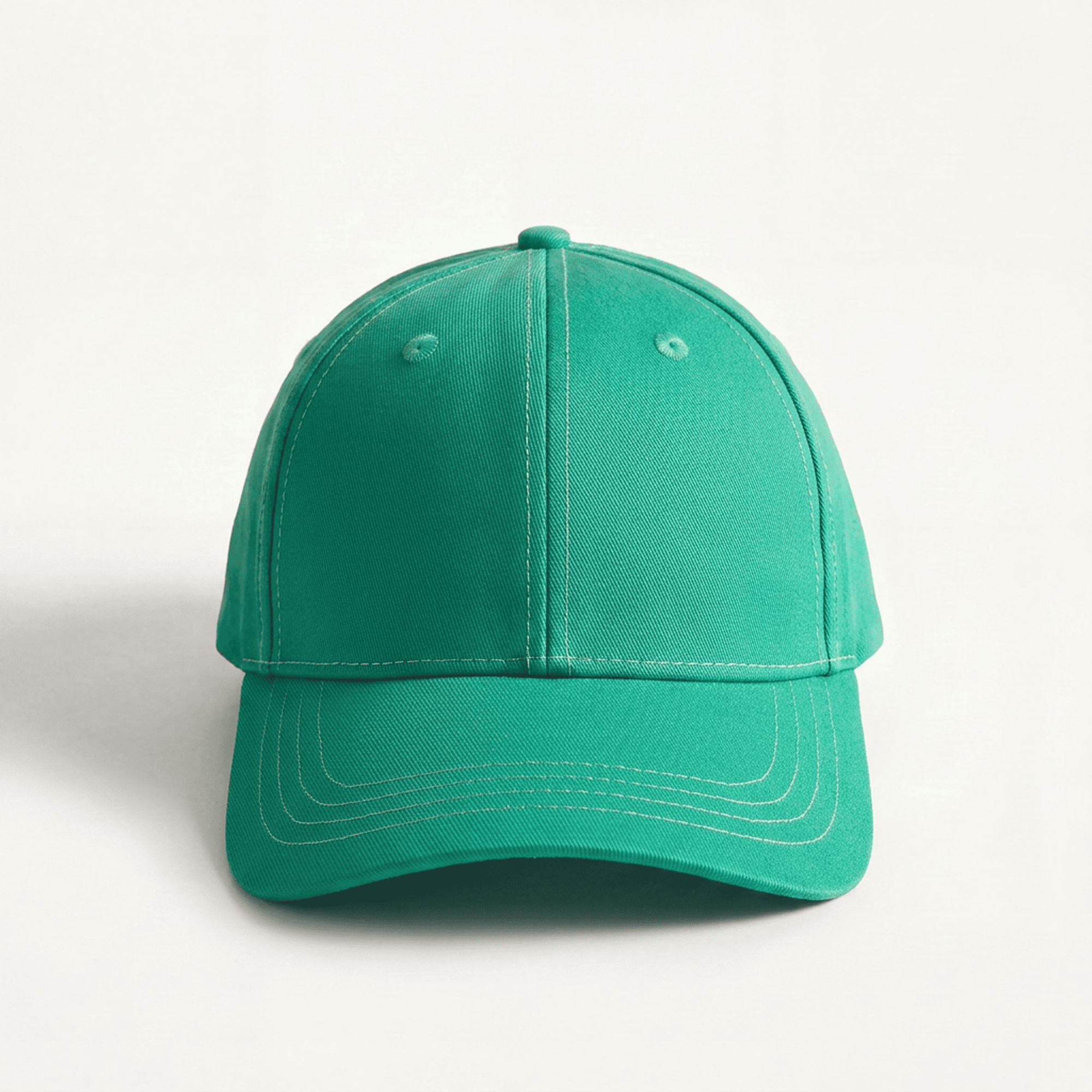 Green baseball cap on a light gray background