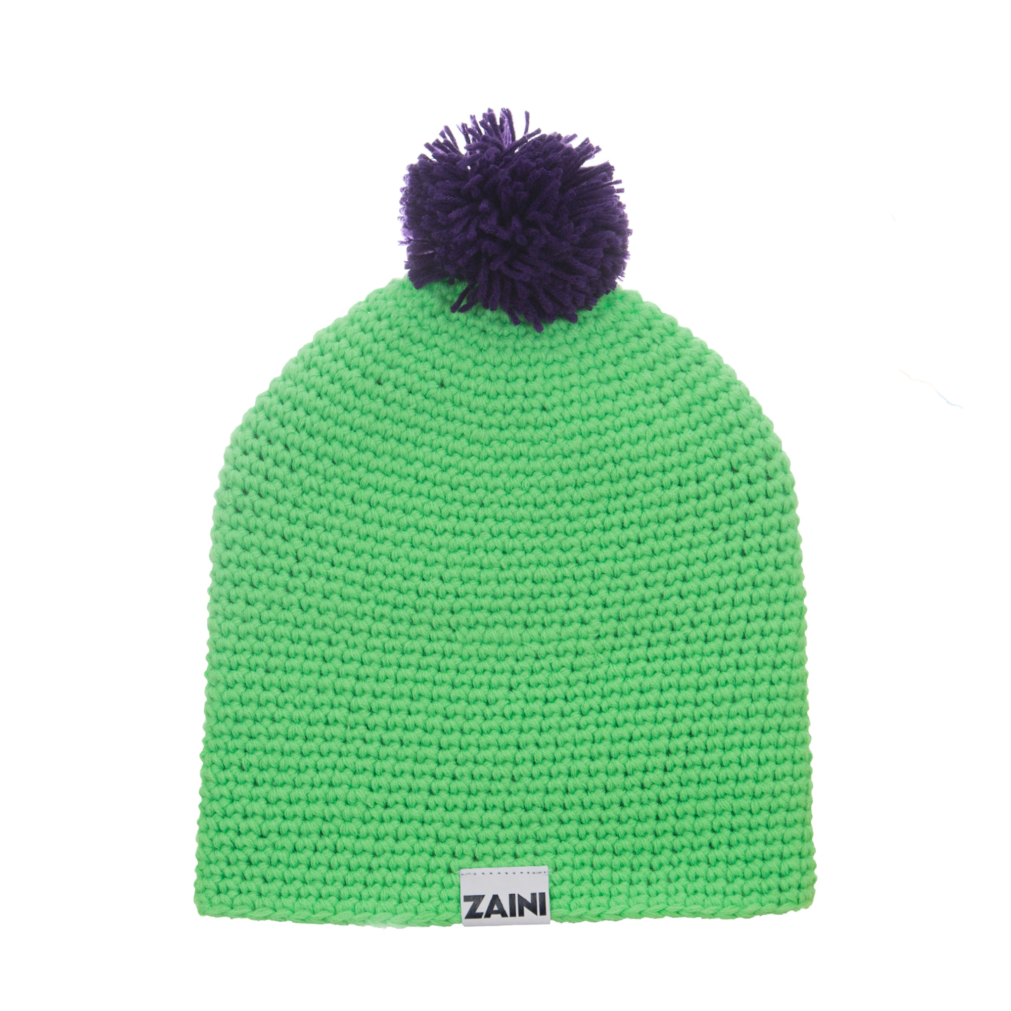 A green bobble hat with a deep purple pom-pom on top, branded with the name 'ZAINI' on the front.