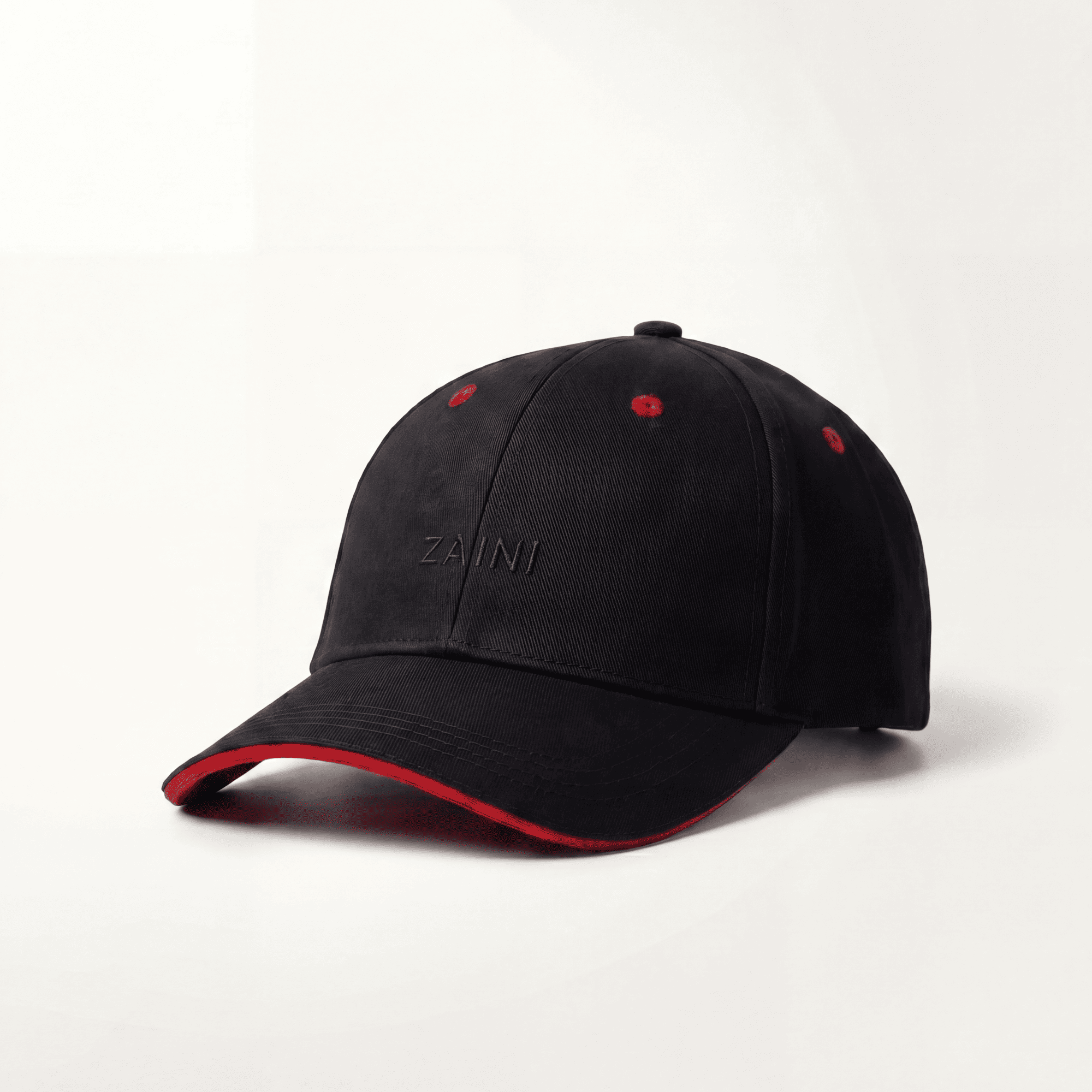 Black cap with red interior and rim on a white background