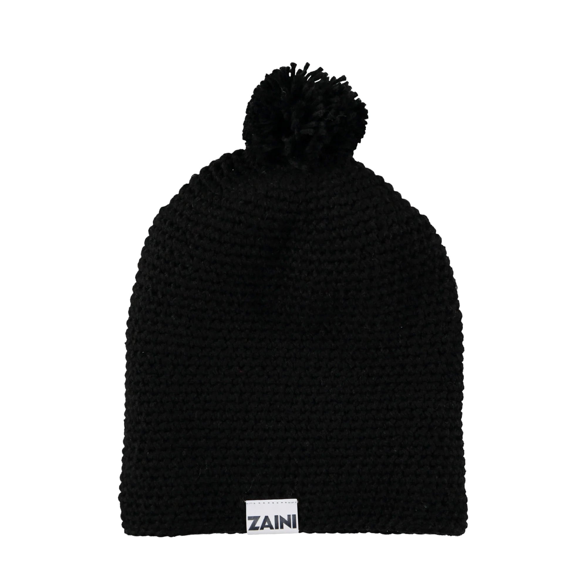 Black knit beanie with pom-pom on a white background