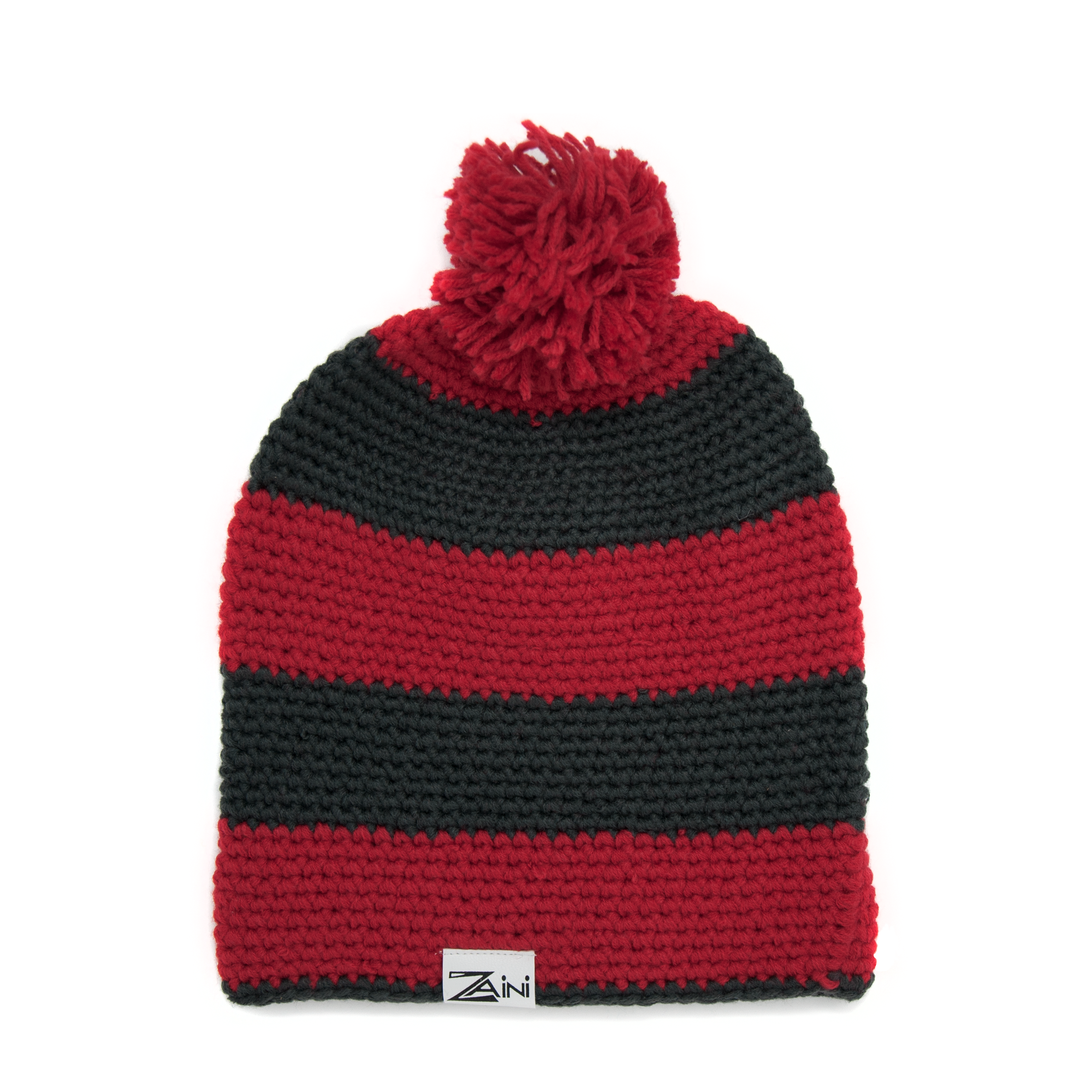 A striped bobble hat with black and red colors, handmade from soft acrylic, with a pom-pom on the top.