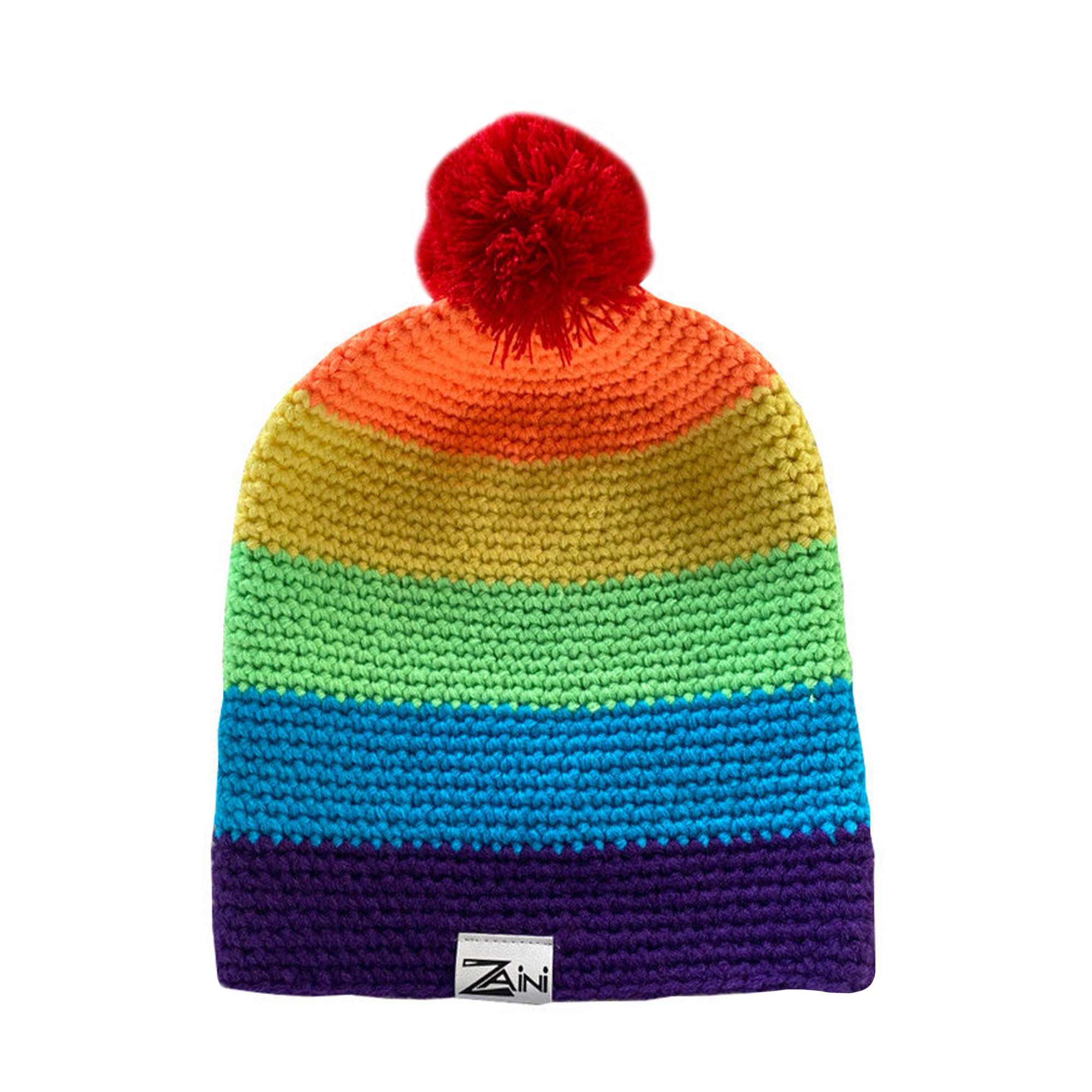 A striped rainbow-colored beanie with a red pom-pom on top, made from acrylic yarn.