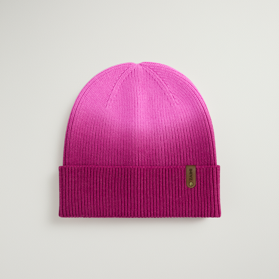 Purple beanie hat on a light gray background