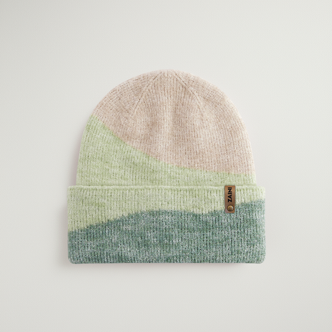 Knitted beanie with gradient color design on a light gray background