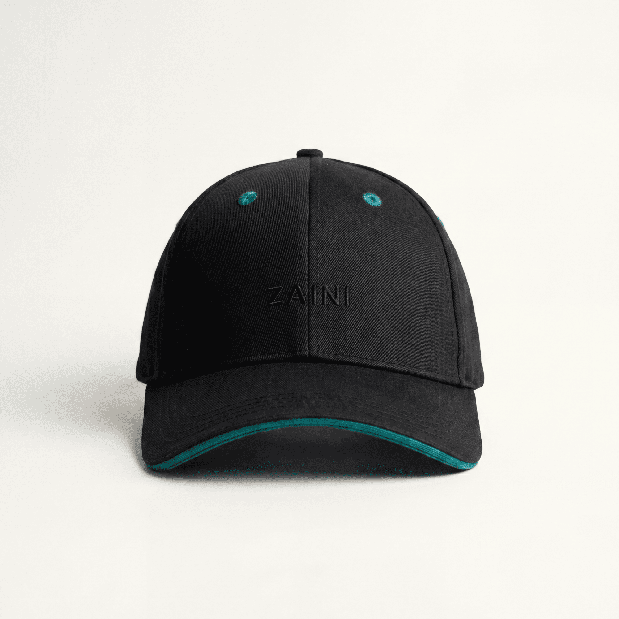 Black cap with teal accents on a white background