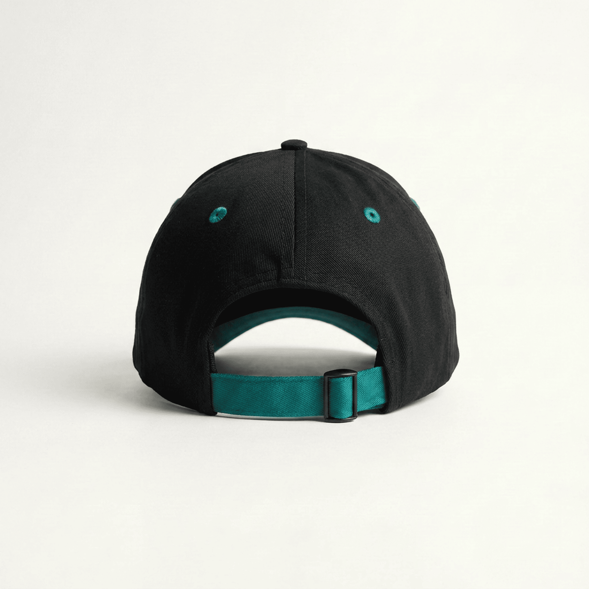 Black cap with a teal strap on a white background