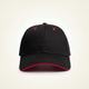 Black cap with red interior and rim on a beige background