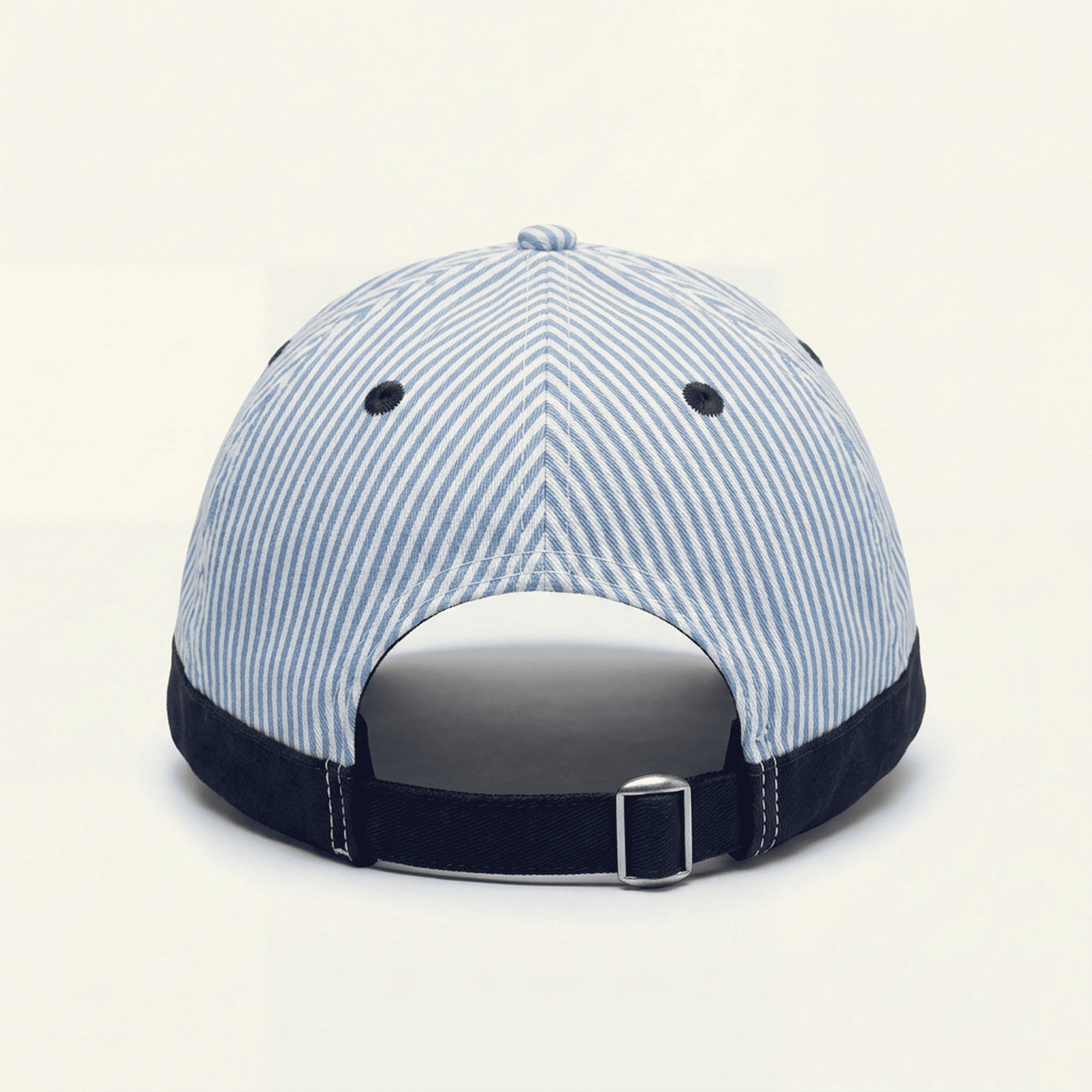 Blue and white striped baseball cap on a beige background