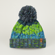 Knitted beanie with green and blue pattern and gray pom-pom on a light gray background