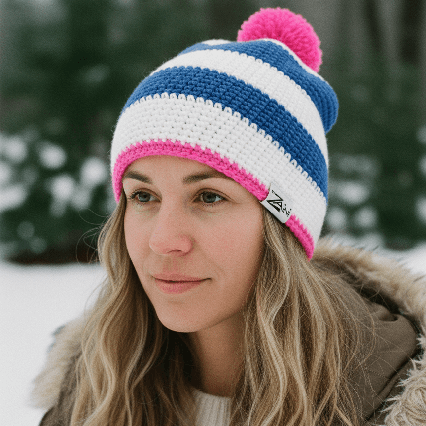 Woman wearing a colorful striped beanie in a snowy outdoor setting