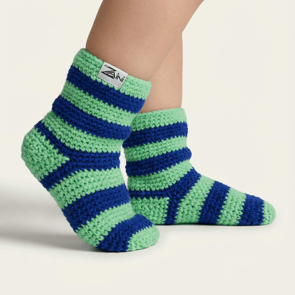 Green and blue striped socks with a brand label on a light background