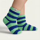 Green and blue striped socks with a brand label on a light background