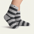 Gray and black striped socks with a brand label on a white background
